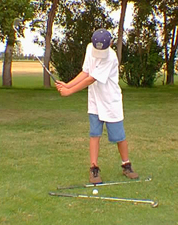 kidpitch_backswing.JPG (58663 bytes)